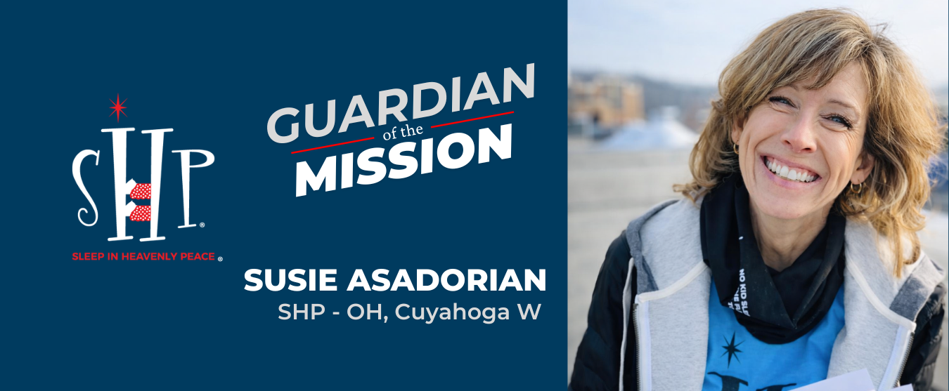 Susie Asadorian GOMA Blog Banner Susie Asadorian, 2025 Guardian of the Mission Award recipient from Sleep in Heavenly Peace - OH, Cuyahoga W, smiling outdoors wearing a blue Sleep in Heavenly Peace shirt.