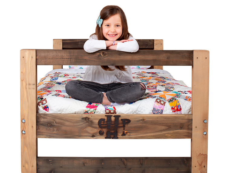 SHP-home-top-girl-bed Girl sitting on SHP Bed
